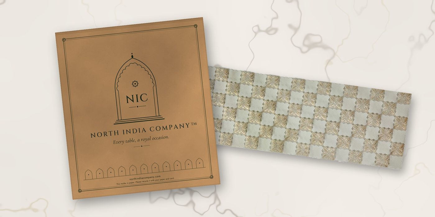 Kraft paper mailer beside a Sheesh Mahal table runner