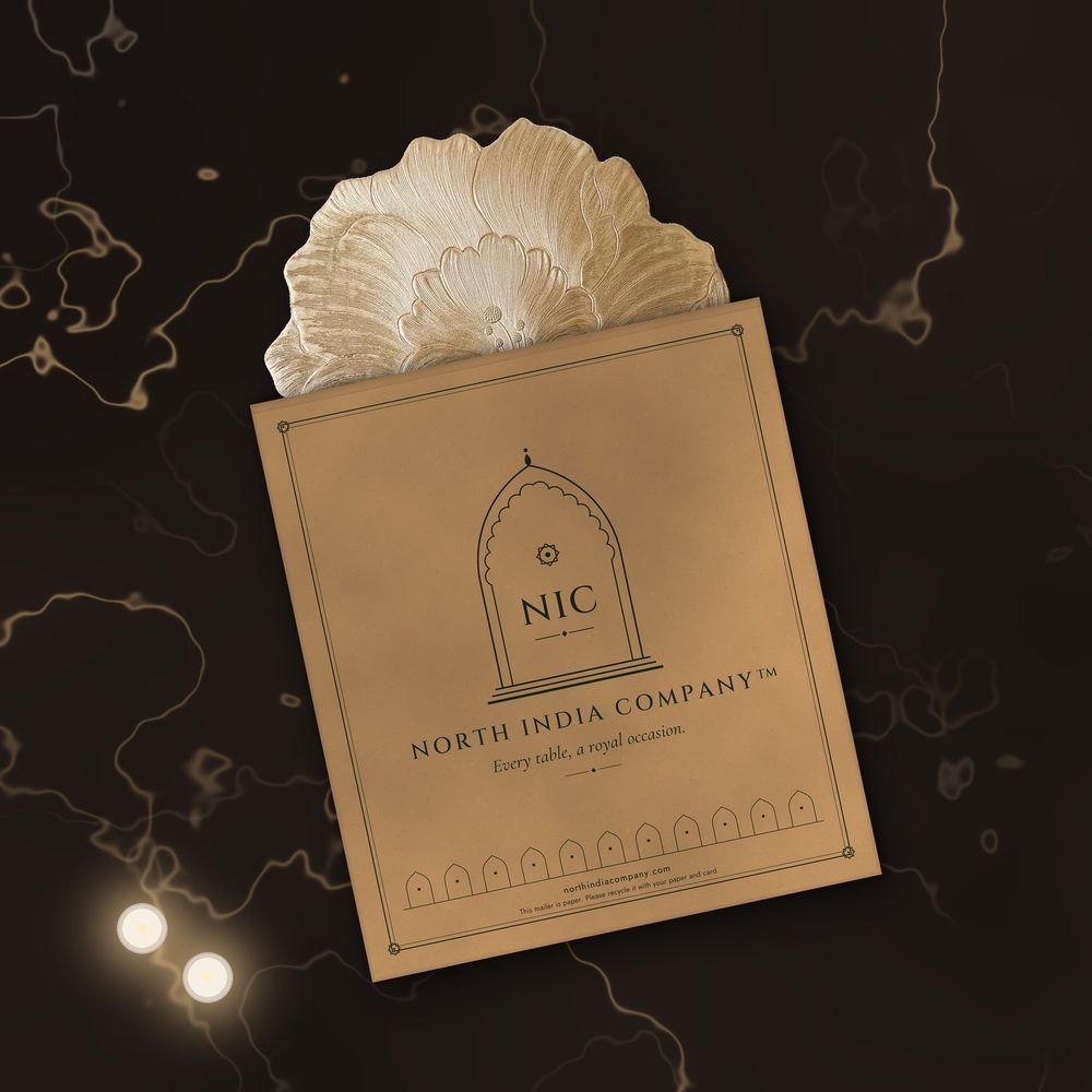 Zari Bloom placemat sliding out of a North India Company kraft paper mailer